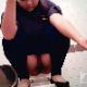 A hidden camera mounted on a public toilet stall door and in another location records a girl squatting over a toilet while smoking. She appears to be trying to shit, but is unable. 2 camera angles are shown. 720P HD quality. About 5 minutes.